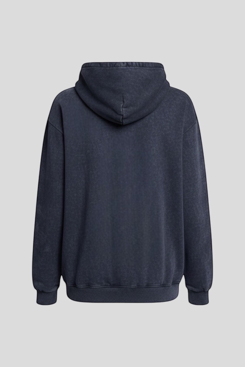 Restless black oversized acid wash hoodie with adjustable hood and front kangaroo pocket. Streetwear style.