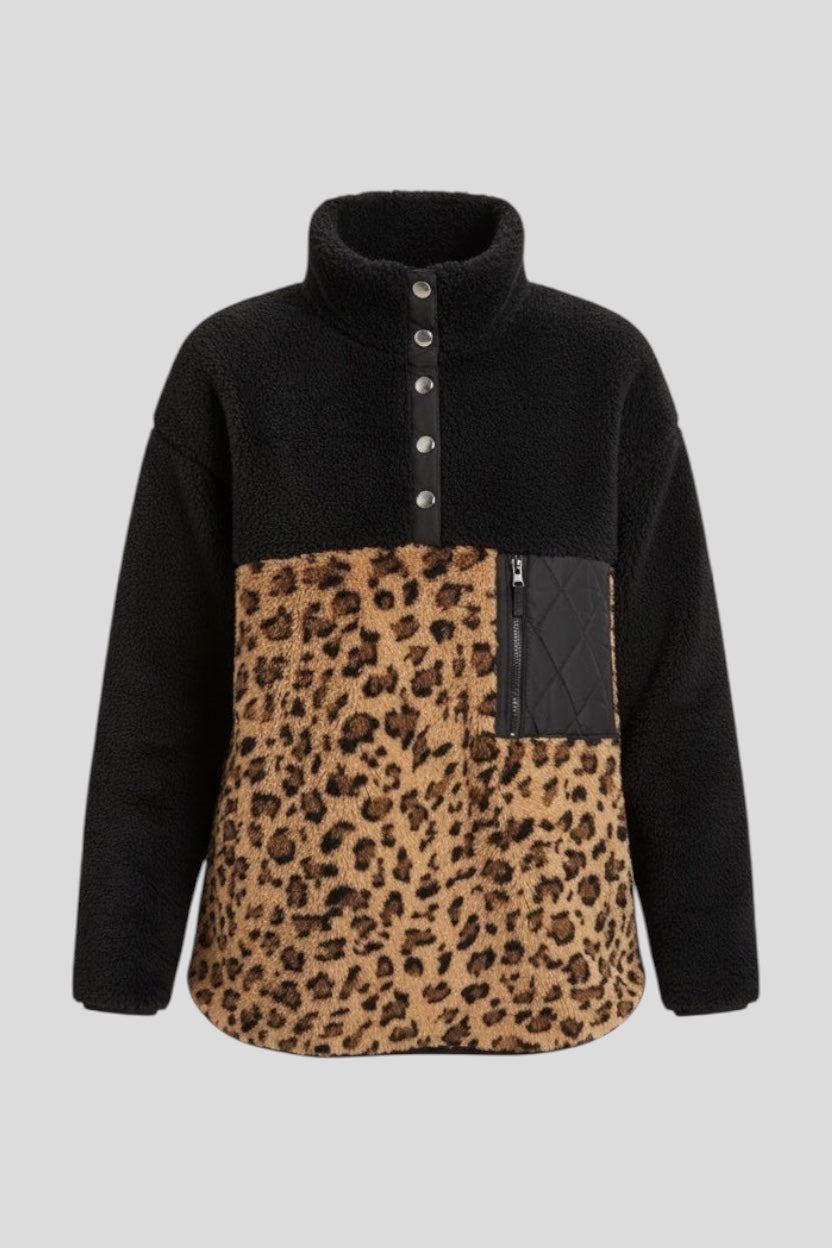Restless black sherpa fleece pullover with leopard print lower half, high neck, and zip pocket.