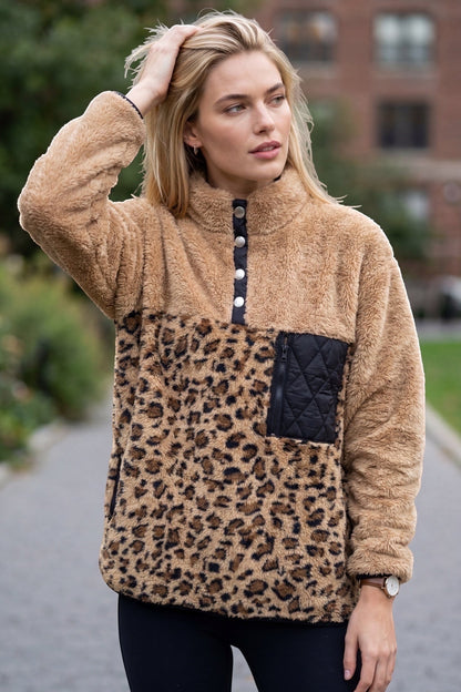 Restless beige and brown leopard print sherpa fleece pullover with black quilted pocket and snap collar.