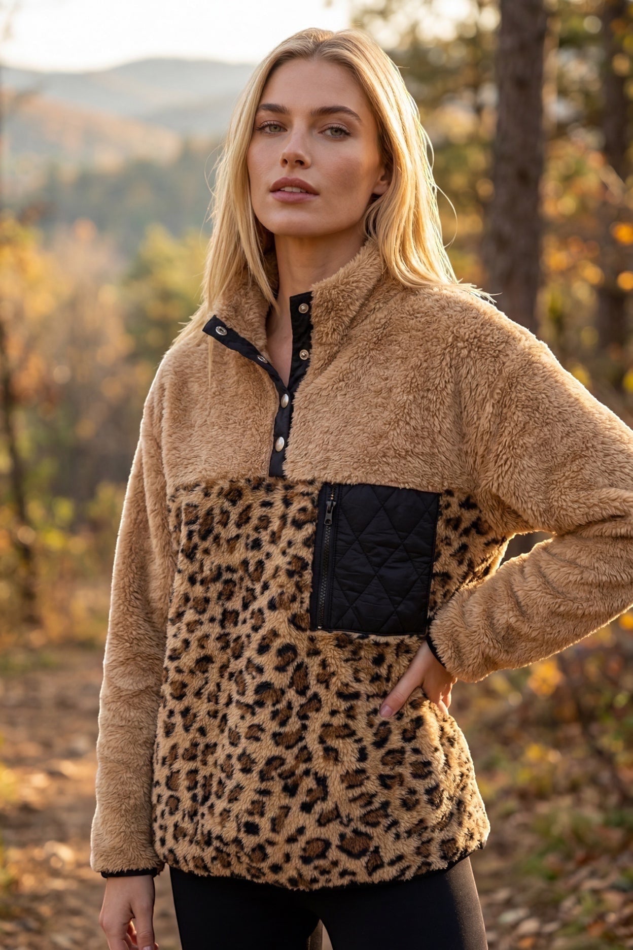 Restless beige and leopard print sherpa fleece pullover with black quilted pocket and snap collar.